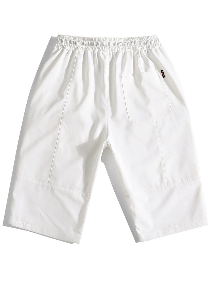 White calf-length men's shorts with drawstring, offering comfort and style, featuring lightweight materials and a pocket.