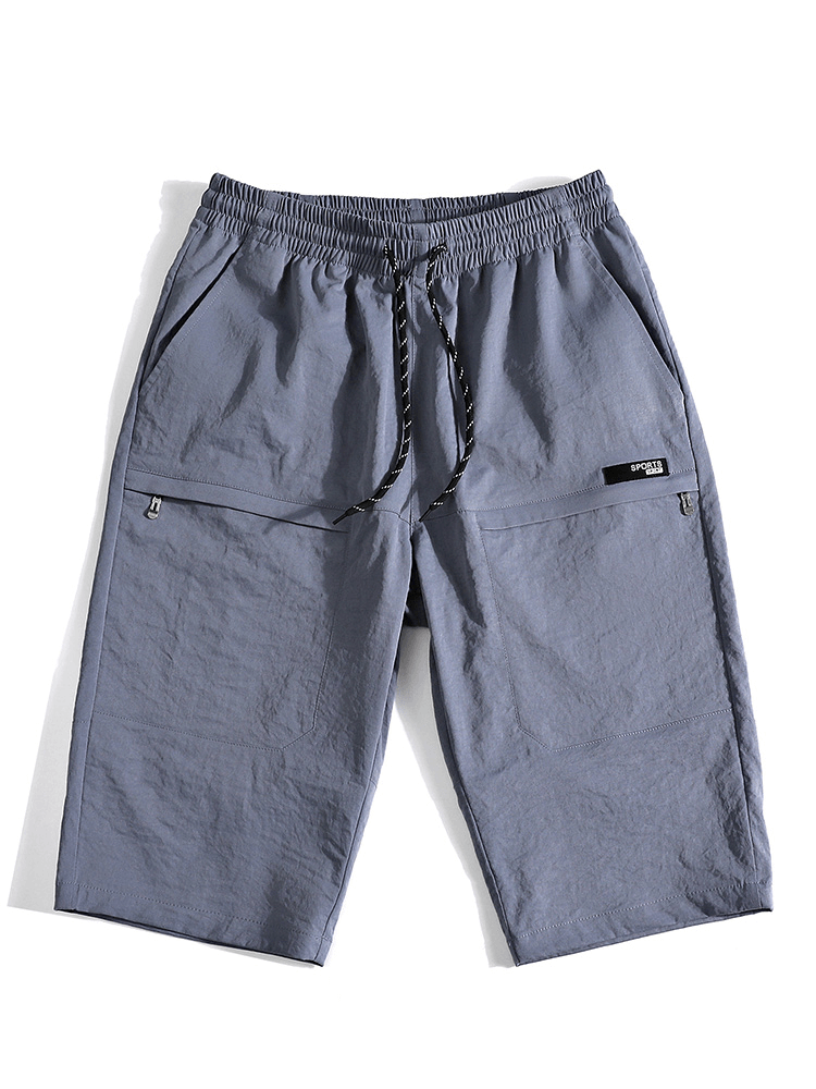 Men’s breathable gray calf-length shorts with drawstring and pockets, perfect blend of comfort and style, model SF1351.