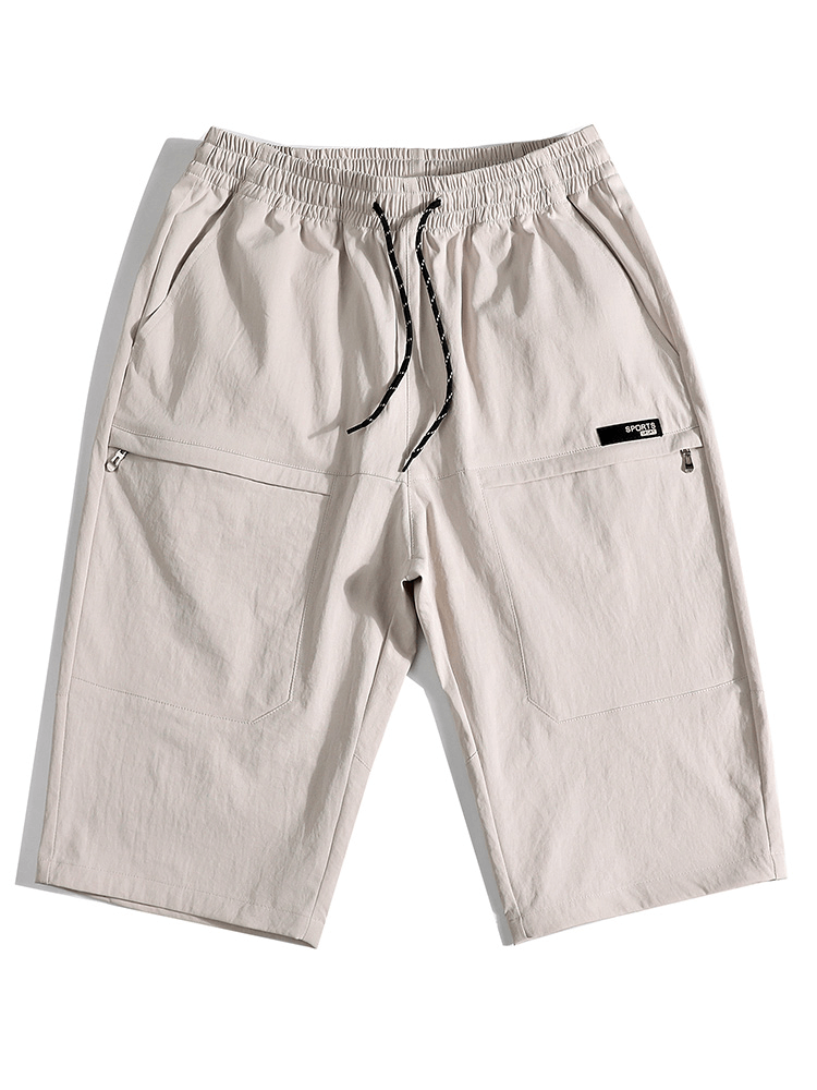 Loose breathable drawstring calf-length shorts for men in beige, featuring pockets, made of spandex and polyester. Model SF1351.