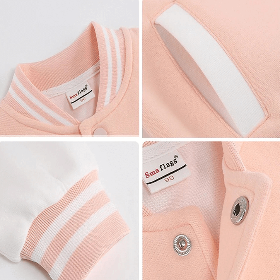 Close-up of kids loose baseball jacket with snap buttons, ribbed cuffs, and soft cotton fabric. Perfect for casual wear and layering.
