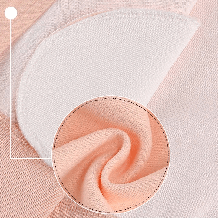 Close-up of soft orange cotton fabric with white stitching detail, ideal for kids' sporty jackets.