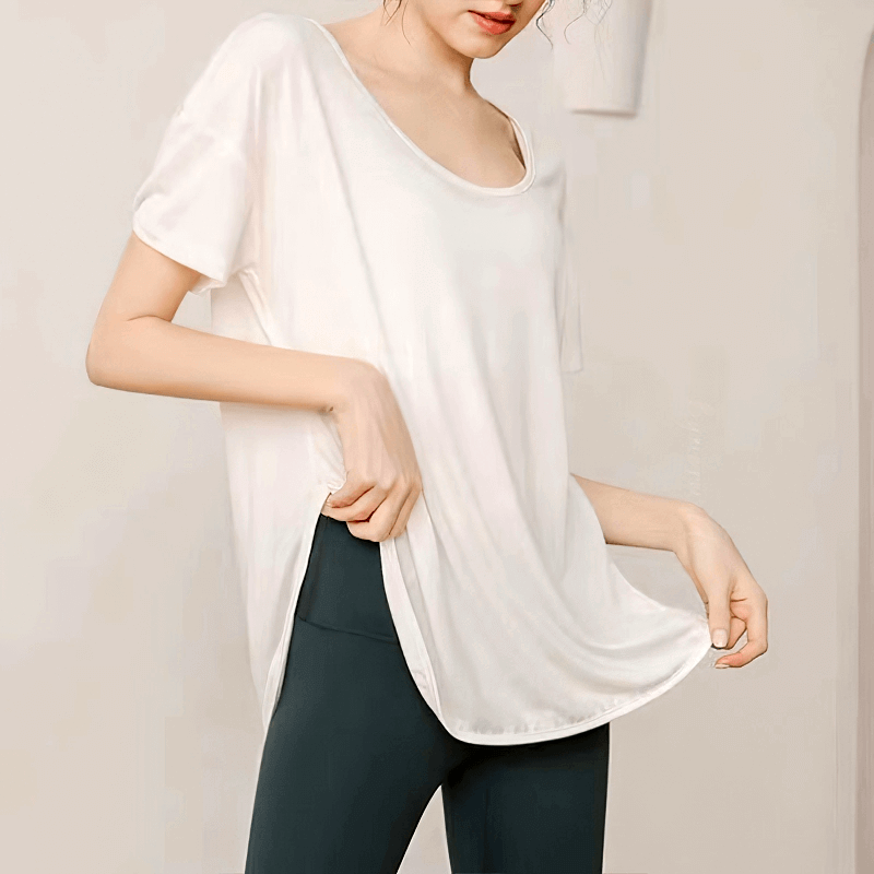 Loose round neck solid color t-shirt for women, perfect for yoga workouts, made from breathable Spandex for comfort and durability.