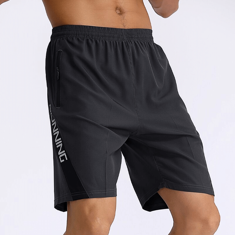 Loose sports quick-dry men's shorts with zippered pockets, showcasing lightweight and breathable polyester material, ideal for active wear.