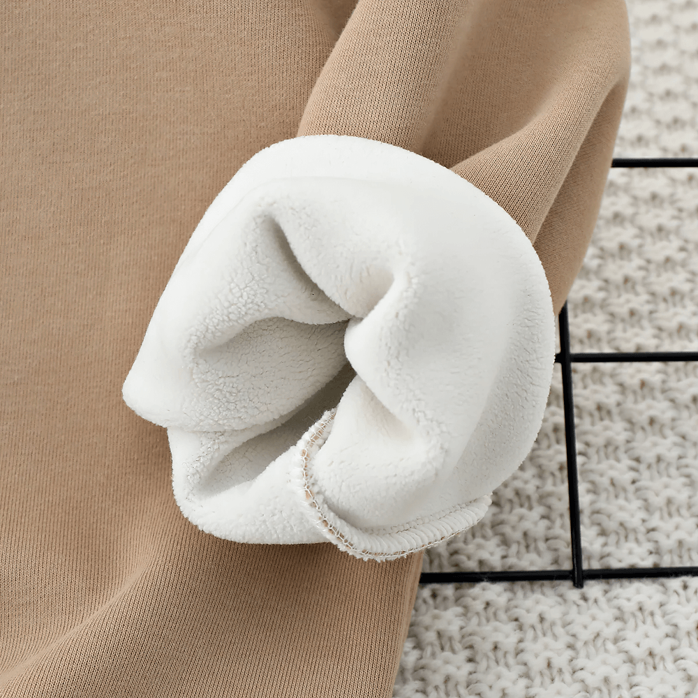Close-up of the plush lining on a Lucky Goldstar Hoodie, showcasing its soft fleece texture ideal for keeping kids warm and cozy.