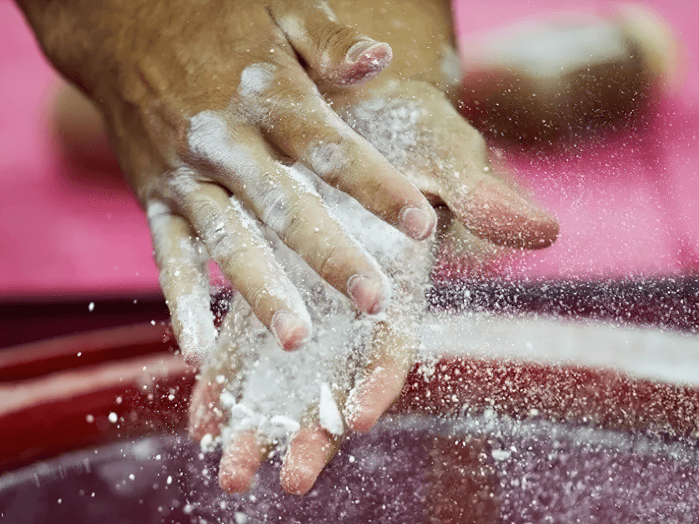 Hands applying Magnesium Carbonate Gym Chalk Blocks for Training - SF3456 to enhance grip for weightlifting and climbing.