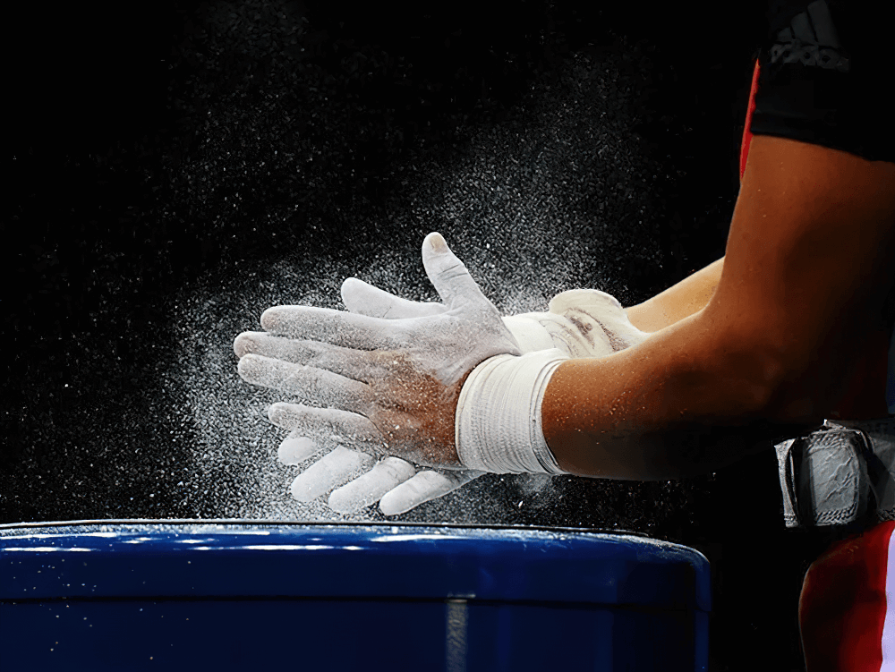 Athlete using Magnesium Carbonate Gym Chalk Blocks for Training - SF3456 to enhance grip during weightlifting session.