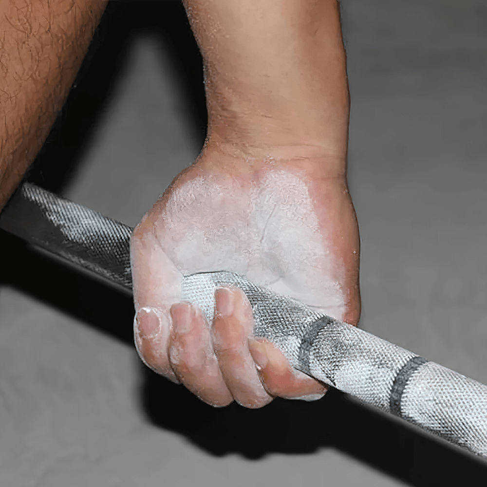 Close-up of hand using Magnesium Chalk Ball for Weightlifting and Climbing - SF3452 gripping a barbell, enhancing gym performance.