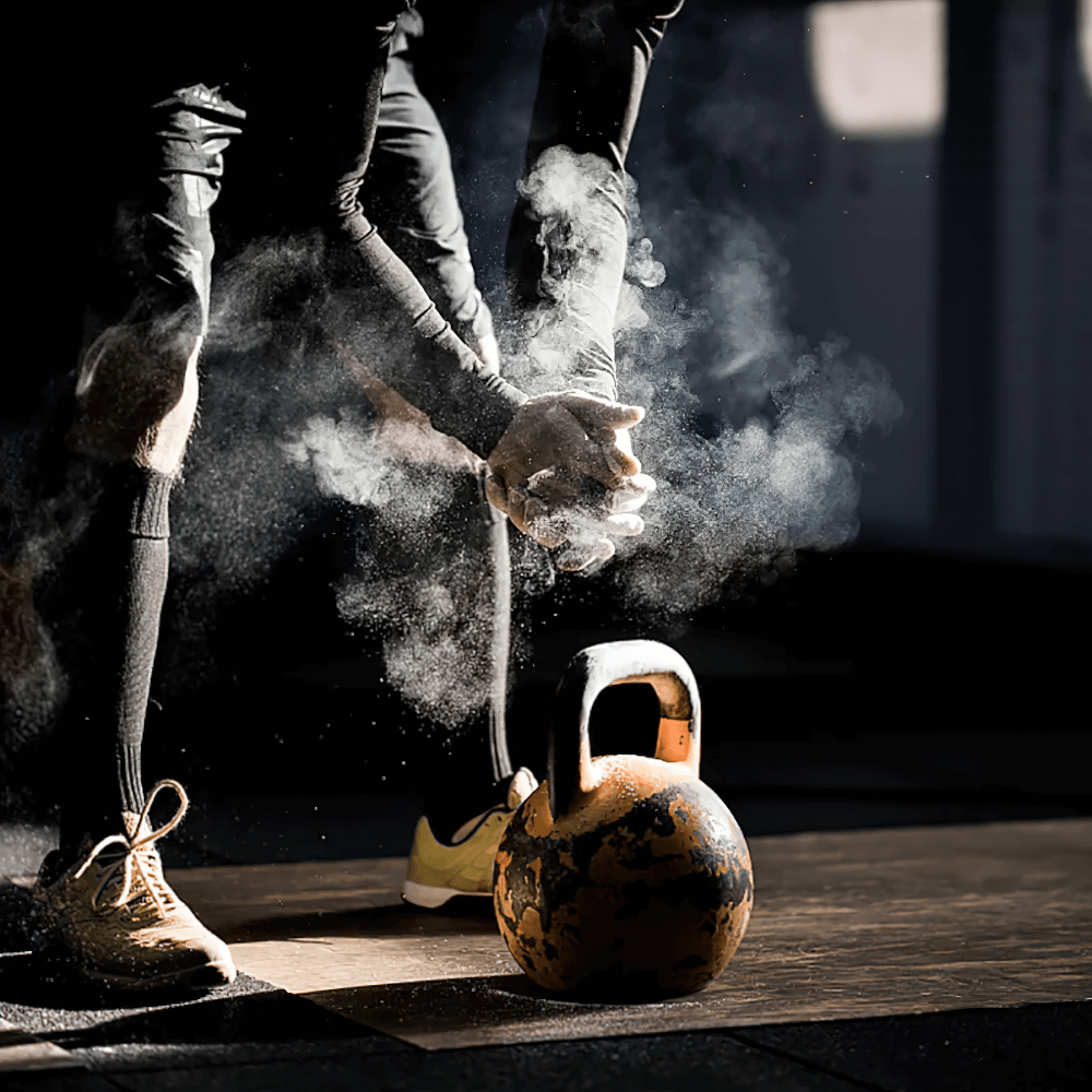 Athlete using Magnesium Chalk Ball for Weightlifting and Climbing - SF3452 with kettlebell, enhancing grip and performance.