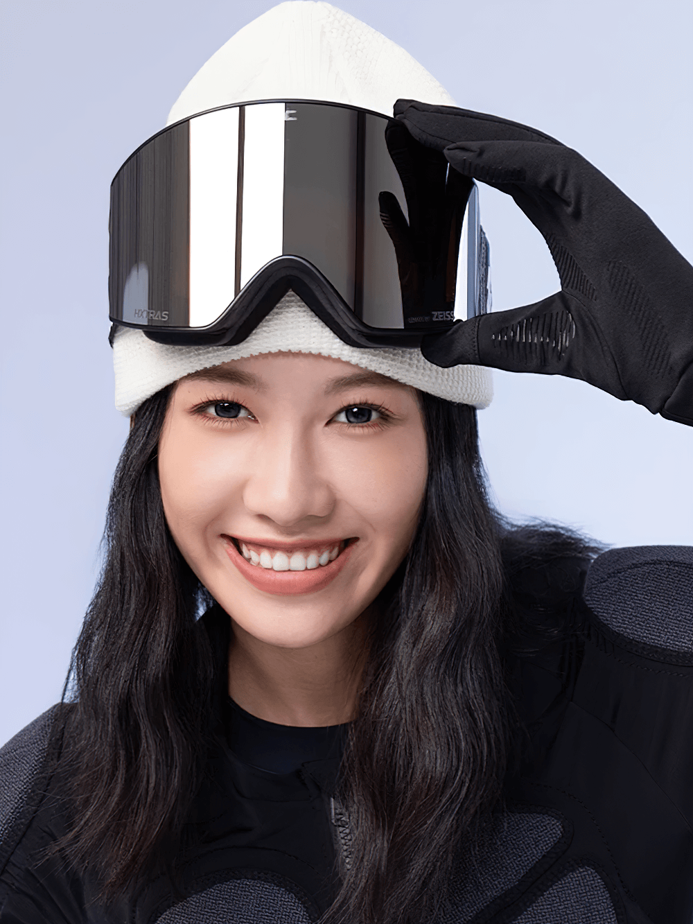 Smiling person wearing Magnetic Ski Goggles with UV400 protection and anti-fog coating, showcasing the MILS Magnetic System.