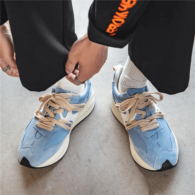 Male breathable sports sneakers with platform in blue, offering comfort and style with cotton upper, great for all activities.