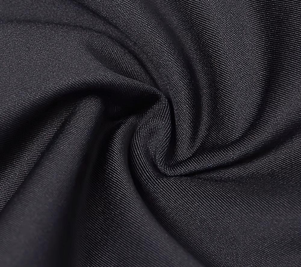 Close-up of black polyester fabric texture, showcasing its smooth weave and durability, ideal for winter cycling gear.