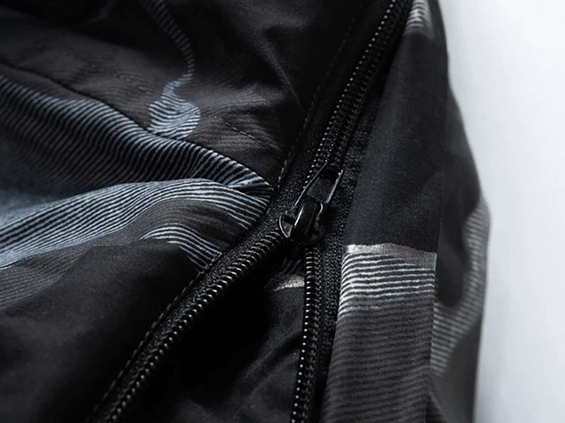 Close-up of zipper on male double-sided hooded ski jacket, highlighting durable polyester fabric and sleek design. Model SF1888.