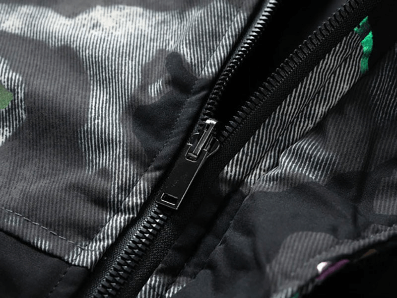 Close-up of the zipper detail on a male double-sided hooded ski jacket showcasing its durable construction.