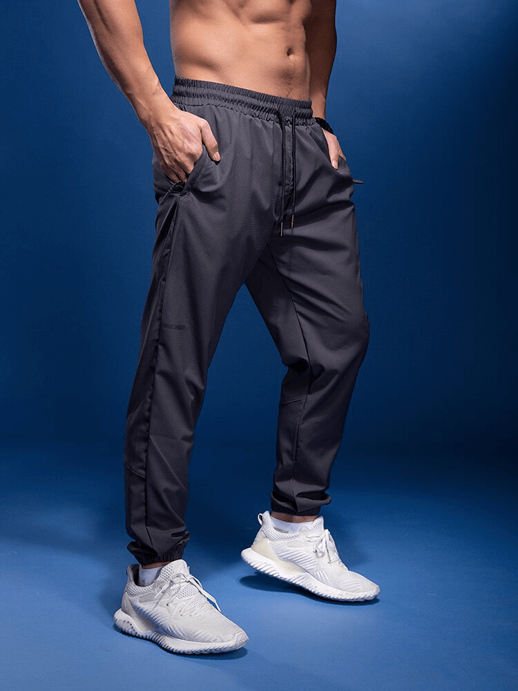 Männliche Laufsport-Jogginghose mit elastischem Bund und Reißverschlusstaschen / Sportbekleidung für Herren – SF1421 