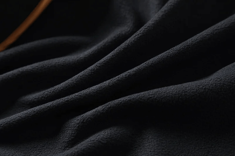Close-up of the waterproof fabric of the SF2207 Male Outdoor Jacket, highlighting its durable, soft texture for hiking and camping.