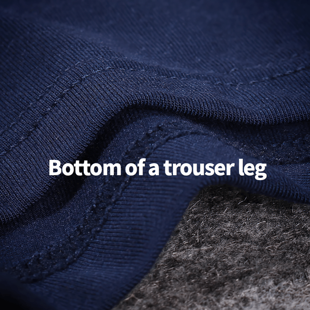 Bottom of a trouser leg showcasing smooth fabric and stitching detail.