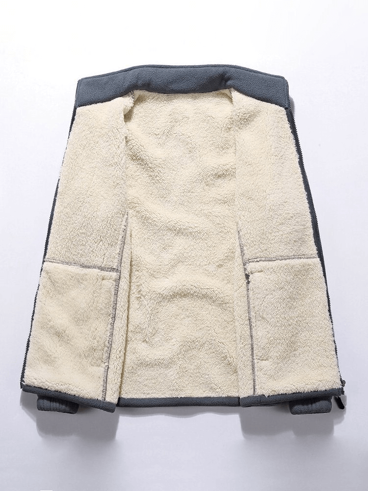 Interior view of a male warm fleece jacket with zipper stand collar, showcasing soft fleece lining and interior pockets for added warmth and storage.