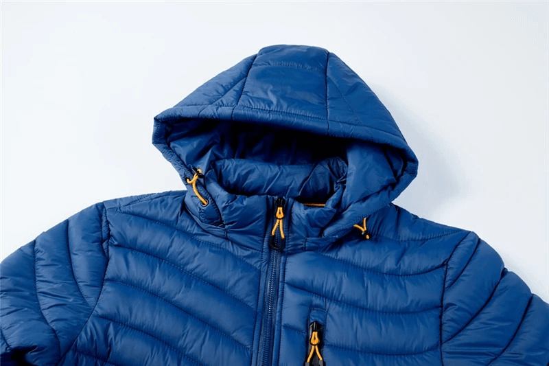 Blue warm jacket with pockets and removable hood, designed for men. Breathable, windproof, and perfect for cold weather.