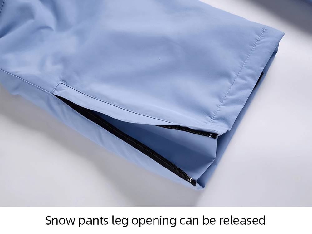 Close-up of light blue ski pants with zipper open, showing adjustable leg opening for easy fit and comfort.
