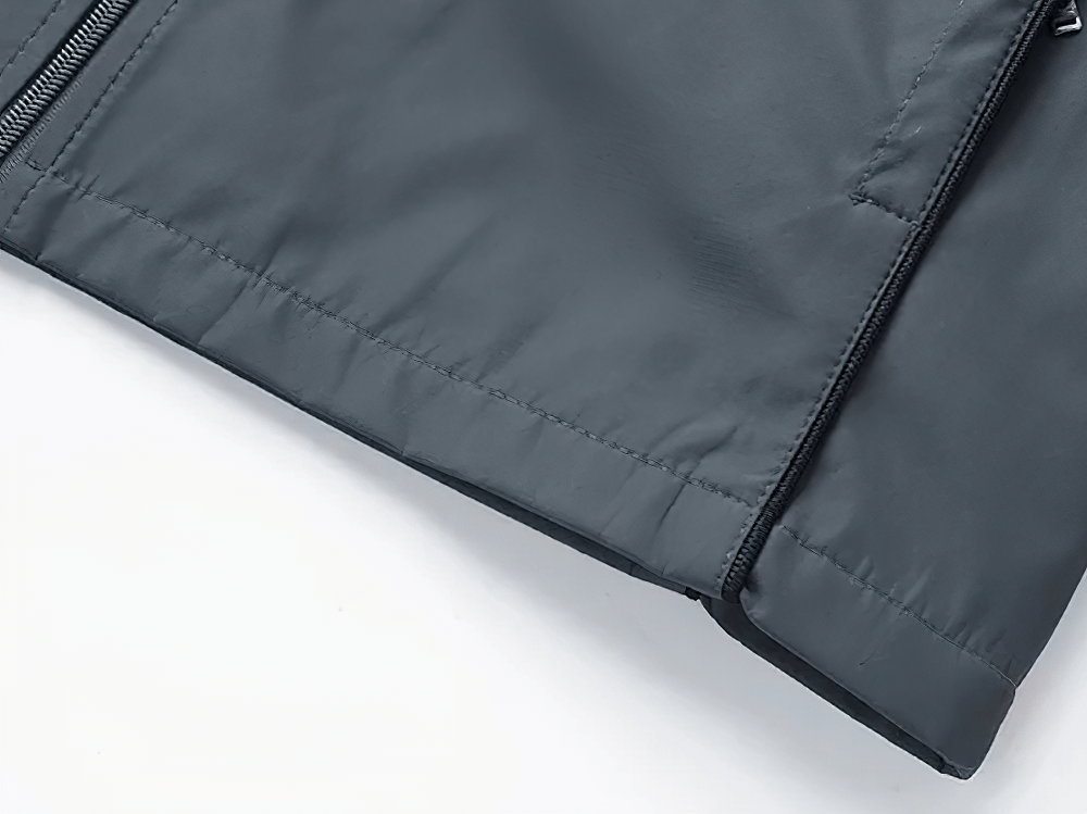 Close-up of the Mandarin Collar Zipper Tracksuit Set's polyester jacket with zipper and printed accents.