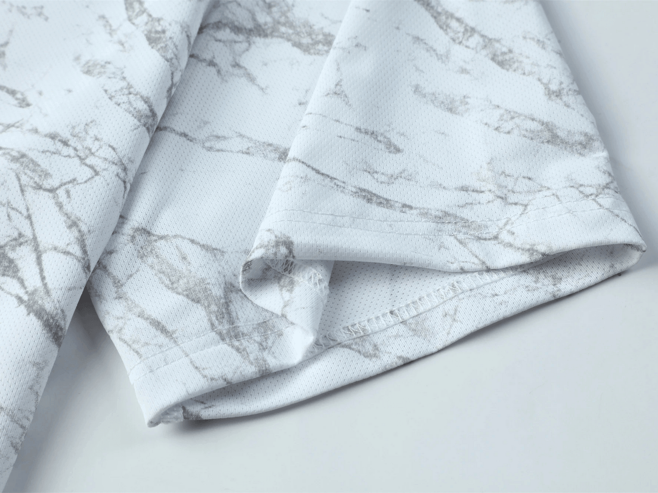Close-up of the fabric of Marble Print Running T-Shirt with Short Sleeves - SF4627 featuring a grey marble pattern.