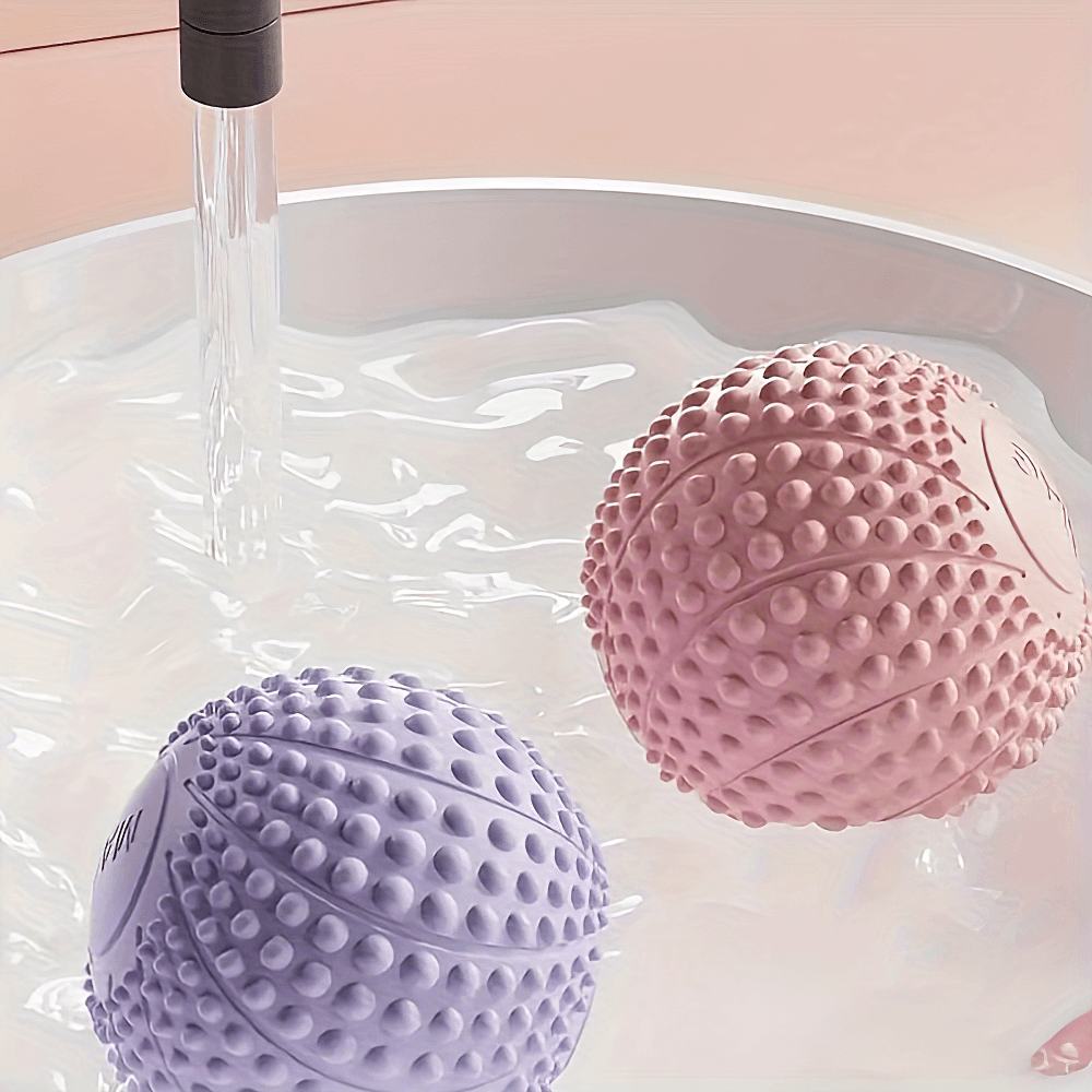 Spiky massage balls in water, perfect for deep tissue relief and muscle tension release. Ideal for athletes and fitness enthusiasts.