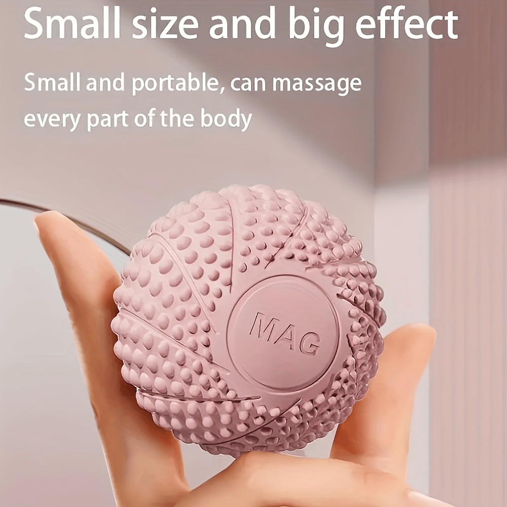 Textured pink massage ball held in hand for muscle relief. Small and portable, ideal for targeting trigger points and enhancing circulation.