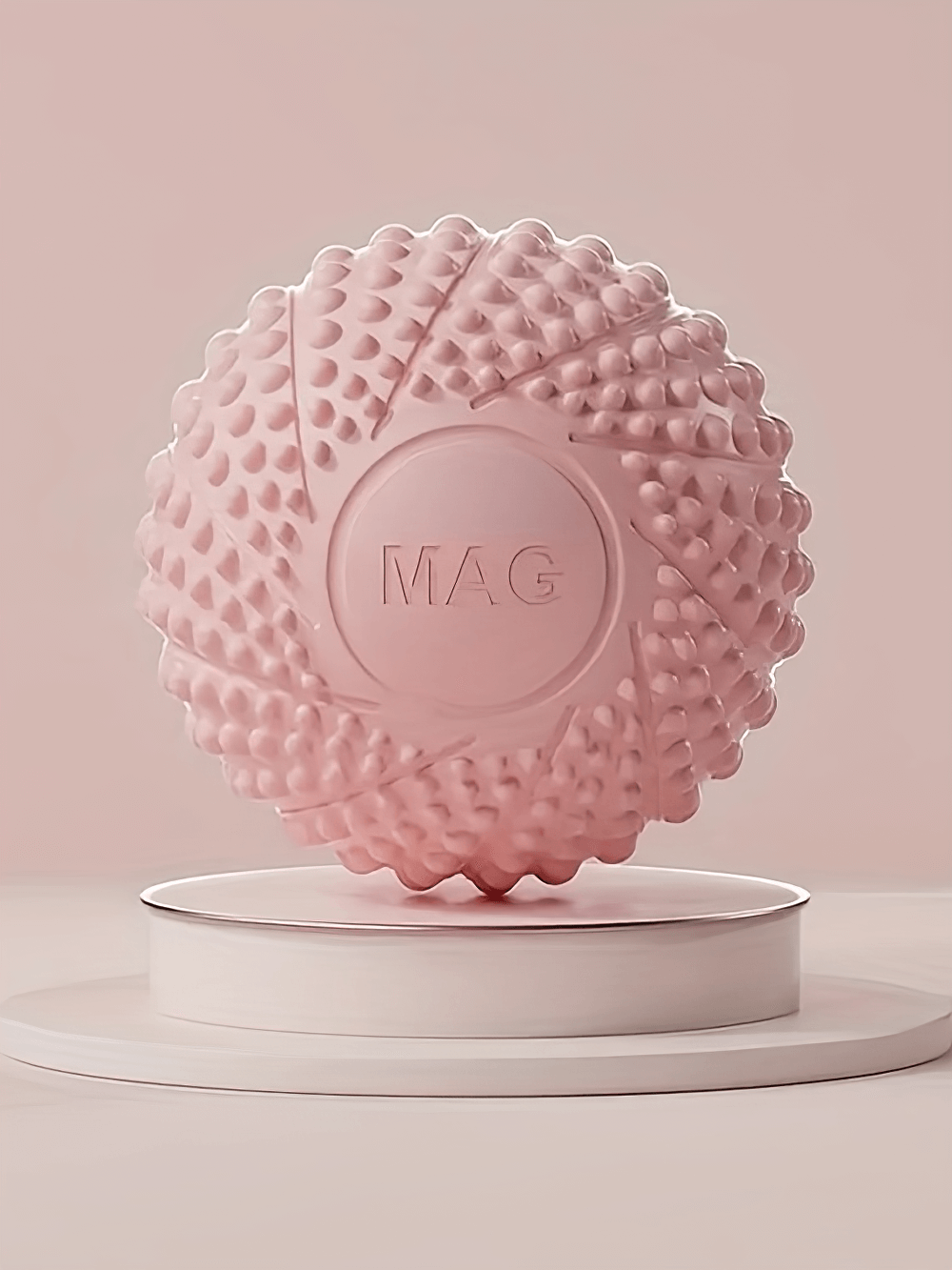 Spiky pink massage ball for deep tissue therapy, ideal for trigger point massage, muscle tension release, and post-workout recovery.