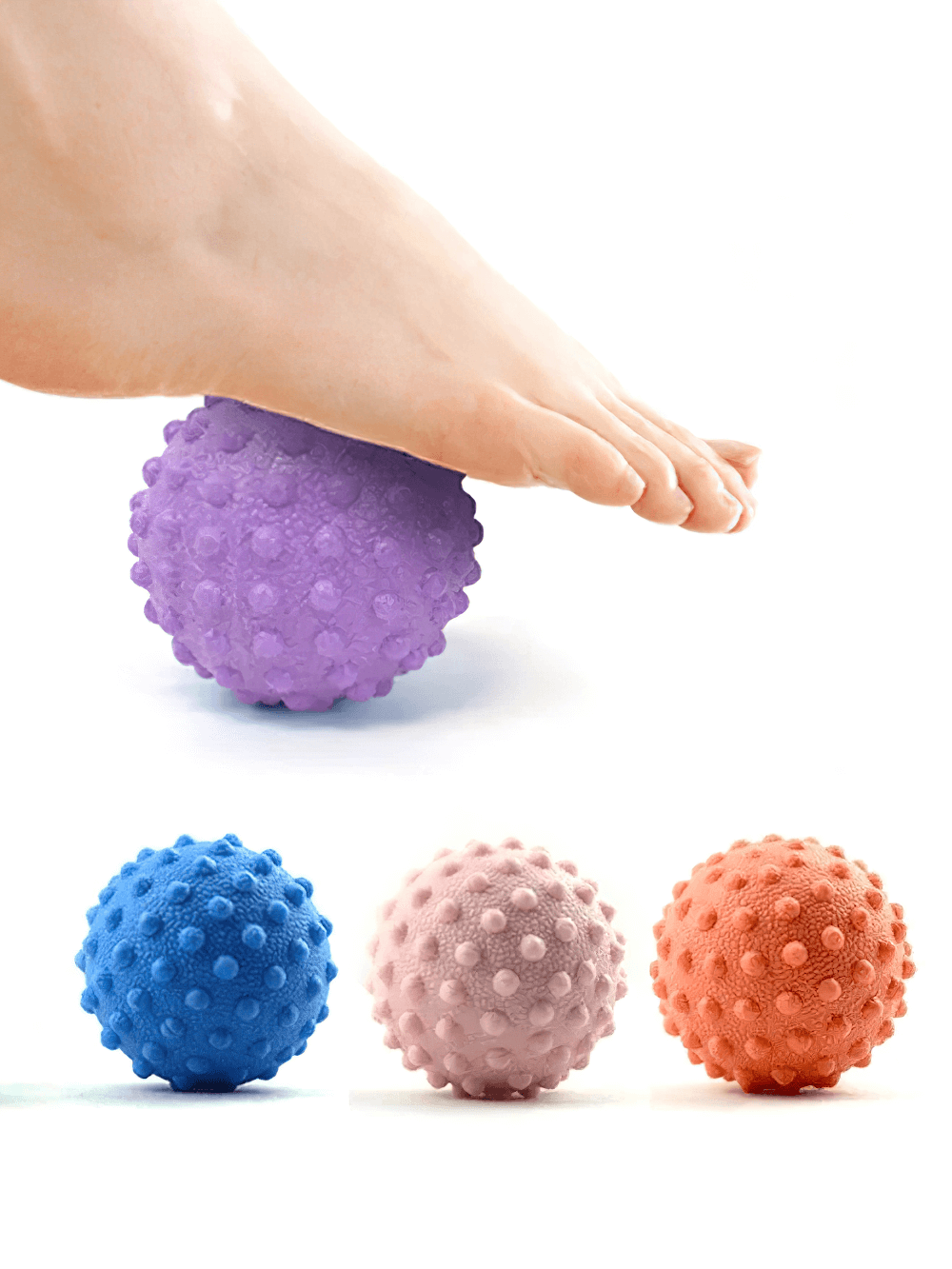 Foot using purple spiky massage ball for deep muscle relaxation, with blue, pink, and orange balls shown below for trigger point therapy.