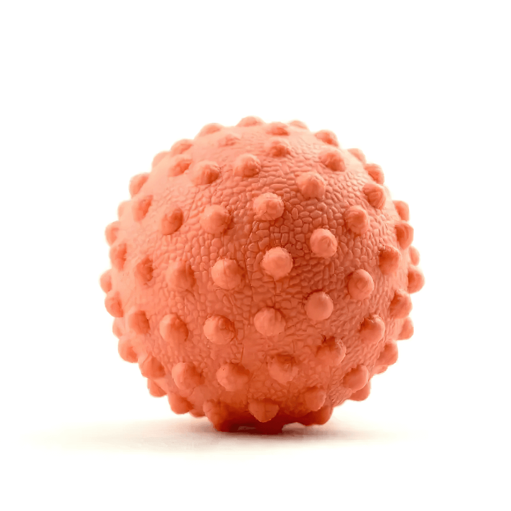 Spiky orange massage ball for muscle relaxation and pain relief, ideal for trigger point therapy and travel use.