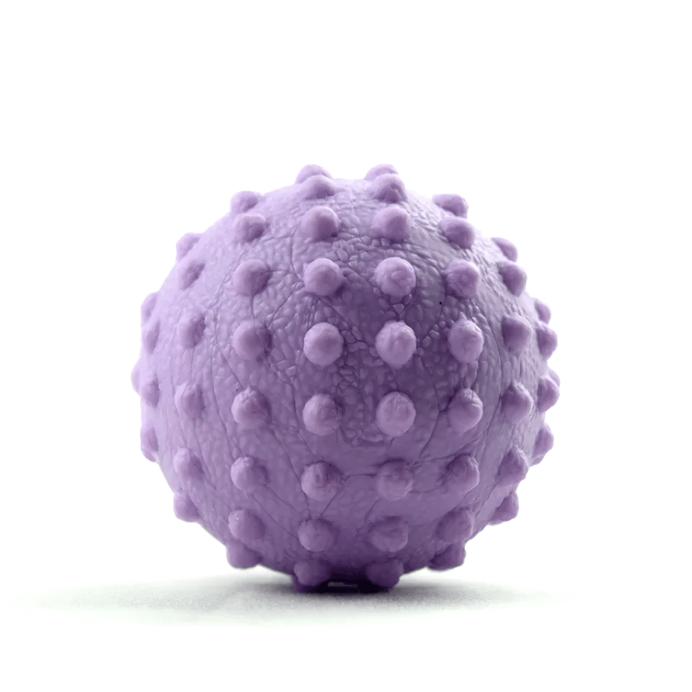 Purple spiky massage ball for deep muscle relaxation, ideal for trigger point therapy and sports recovery; compact and travel-friendly.