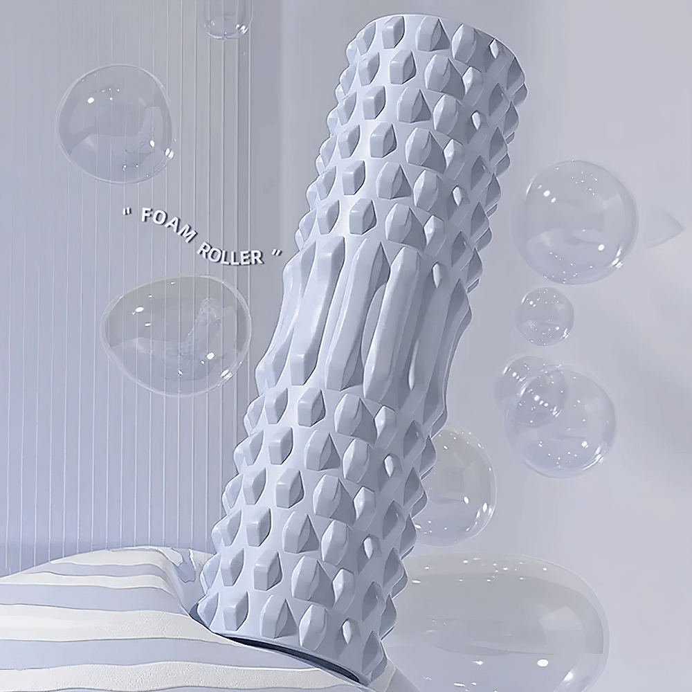 Gray foam roller for muscle relief and flexibility in a serene setting with bubbles, ideal for deep tissue massage and recovery.