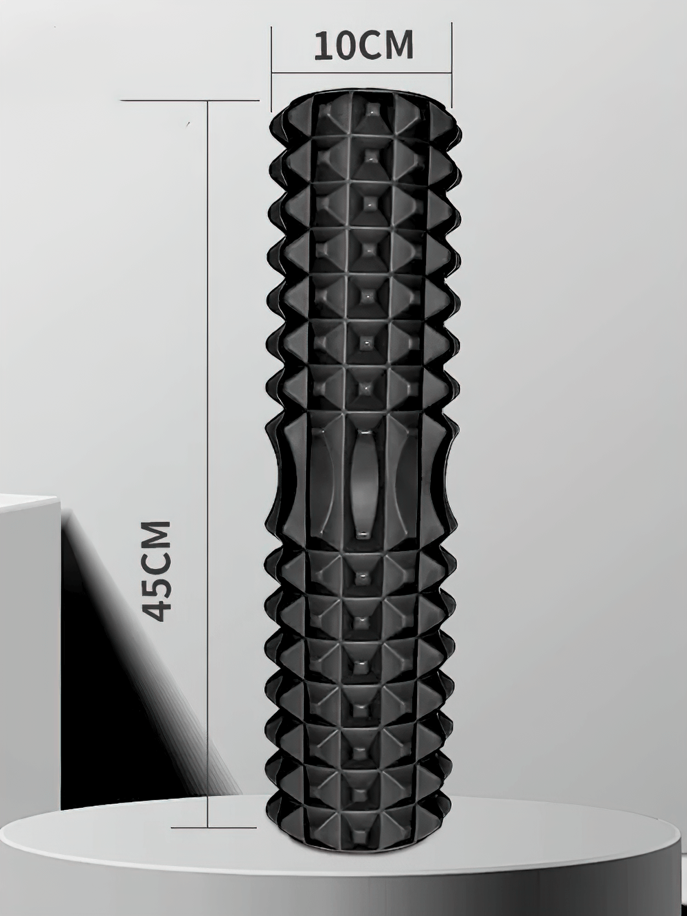 Black massage roller for muscle relief, deep tissue massage, and flexibility, dimensions 45cm x 10cm, eco-friendly design.