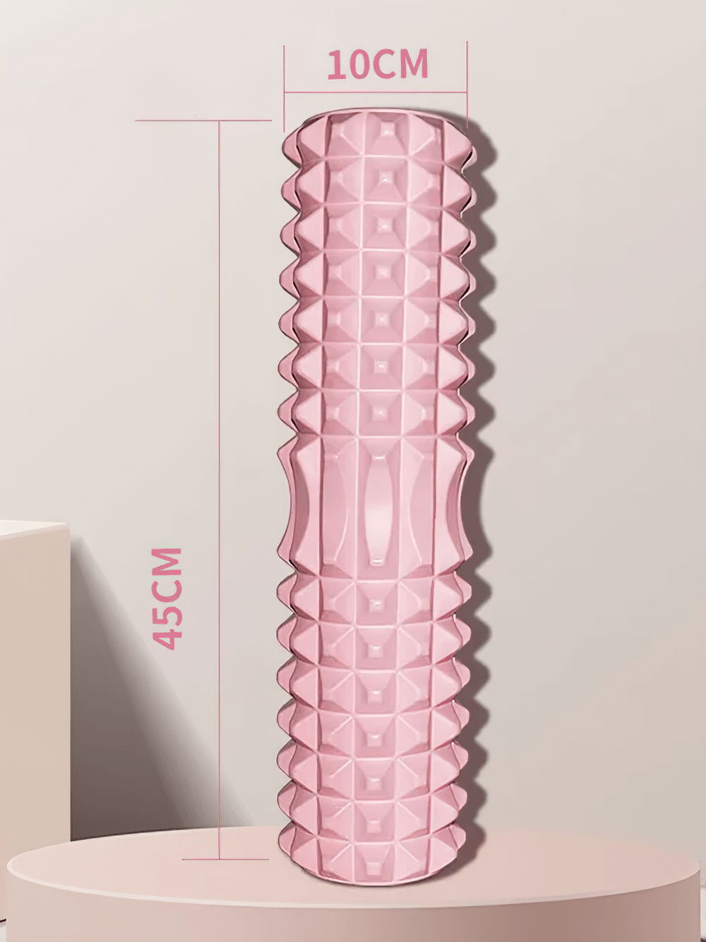 Pink foam massage roller for muscle relief, measuring 45cm x 10cm, designed for deep tissue massage and flexibility enhancement.