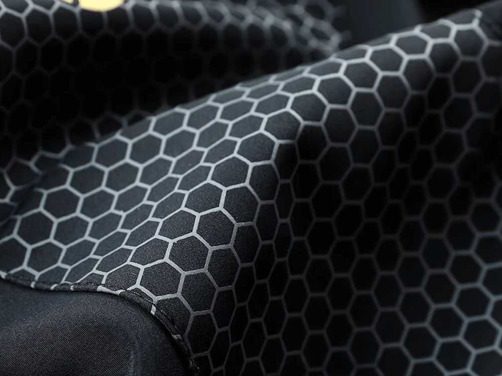 Close-up of hexagonal pattern on men's T90 Sports Tracksuit SF2291, showcasing stylish patchwork design. Durable polyester fabric.