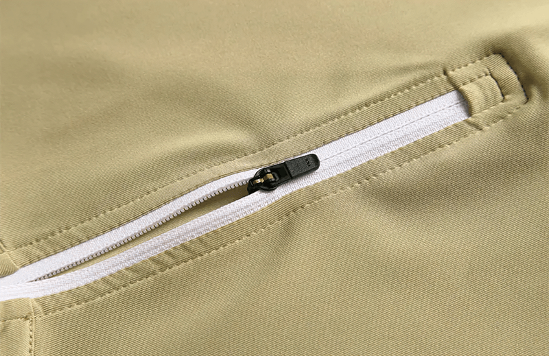 Close-up of a zipper on a men's elastic breathable running T-shirt showcasing its sleek design and secure functionality.