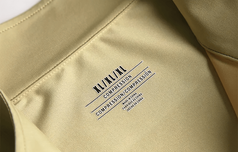 Close-up of yellow Men's Elastic Breathable Running T-Shirt label showing compression features for optimal sports performance.