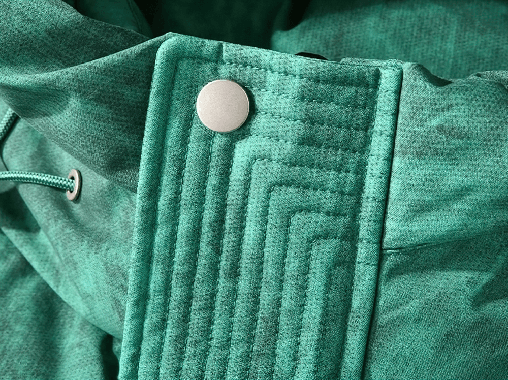 Close-up of the teal hood and snap detail on a men's lightweight duck down puffer jacket, showcasing stylish design elements.