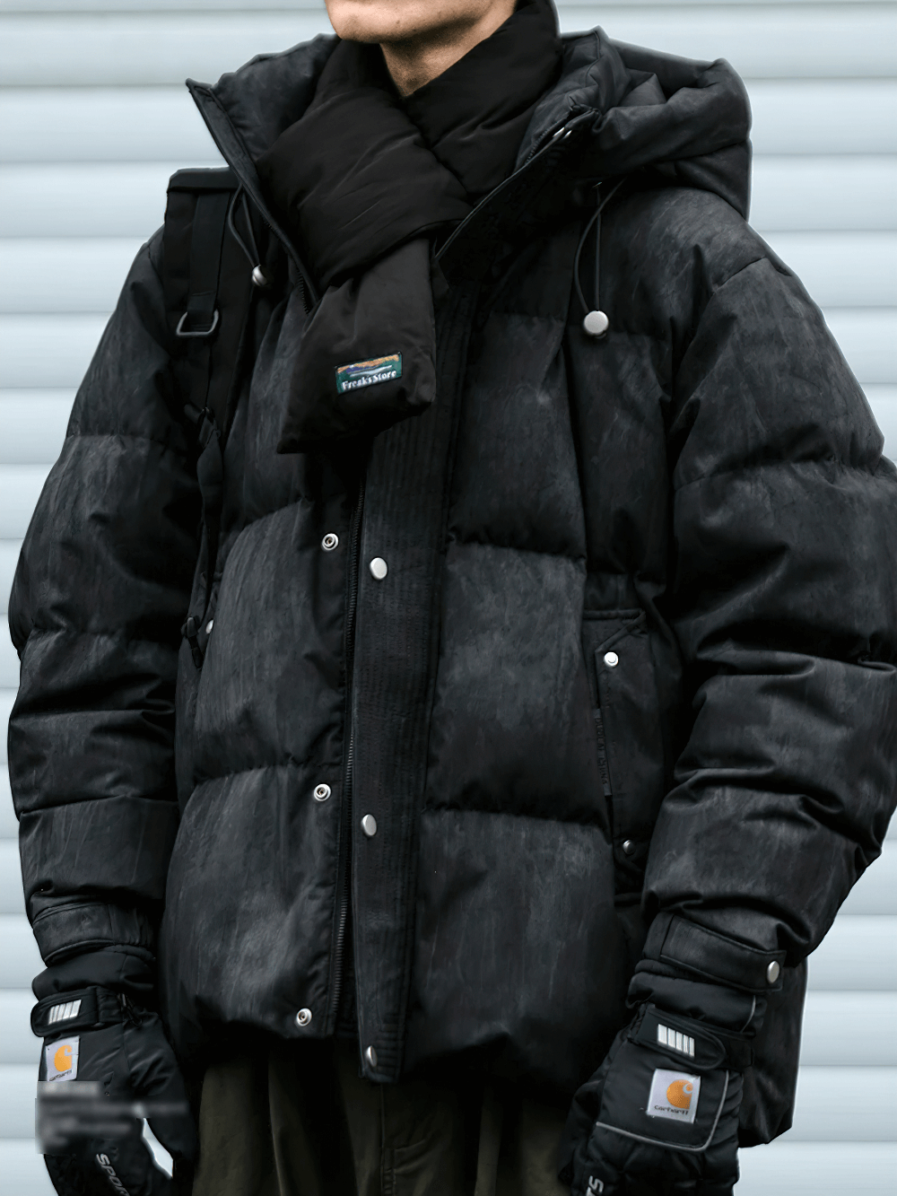 Men's black duck down puffer jacket with hood, featuring zip closure and padded design, perfect for winter streetwear style.