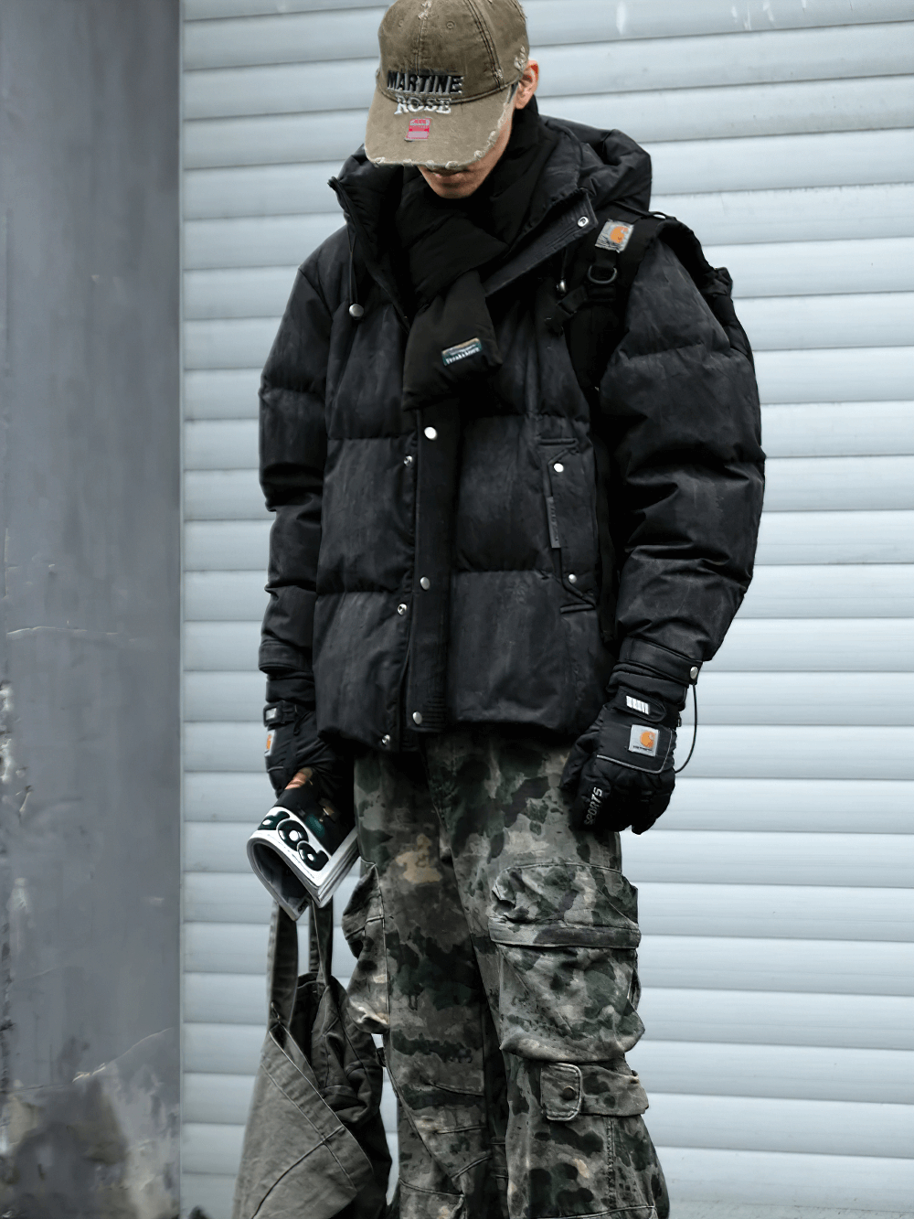 Stylish men’s duck down puffer jacket SF2260 with hood, perfect winter streetwear in black with camo pants.