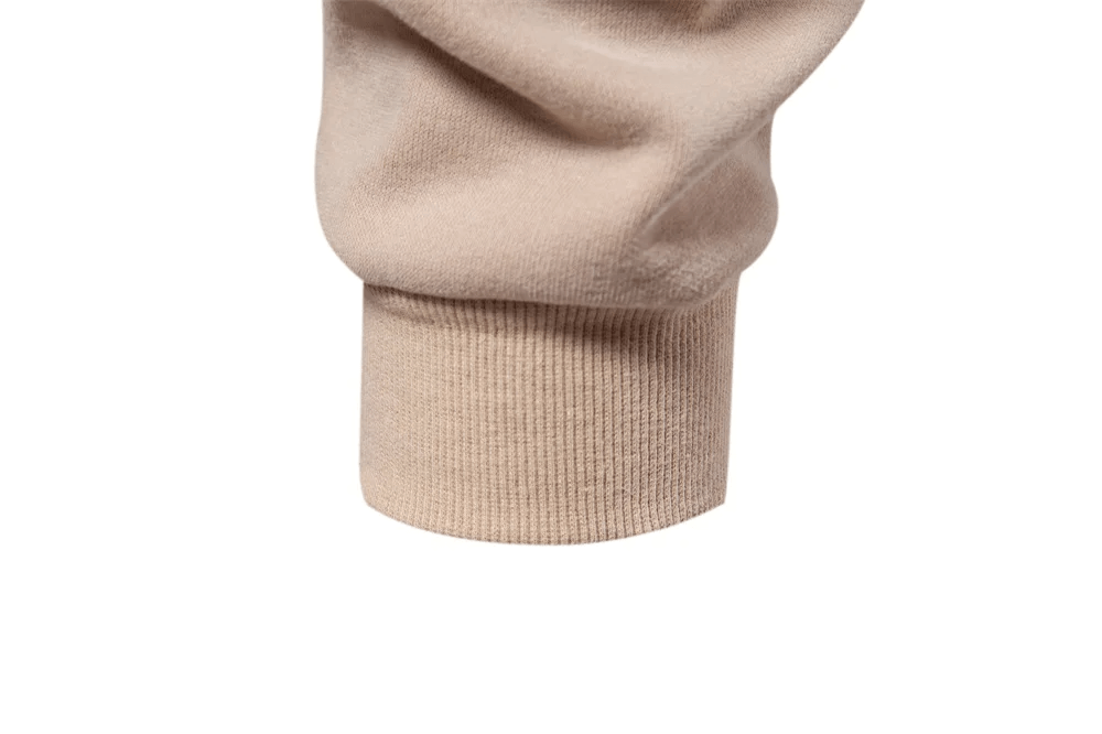 Close-up of a beige cuff on a men's sweatshirt, showcasing soft, breathable fabric. Perfect for casual adventures and sporty style.