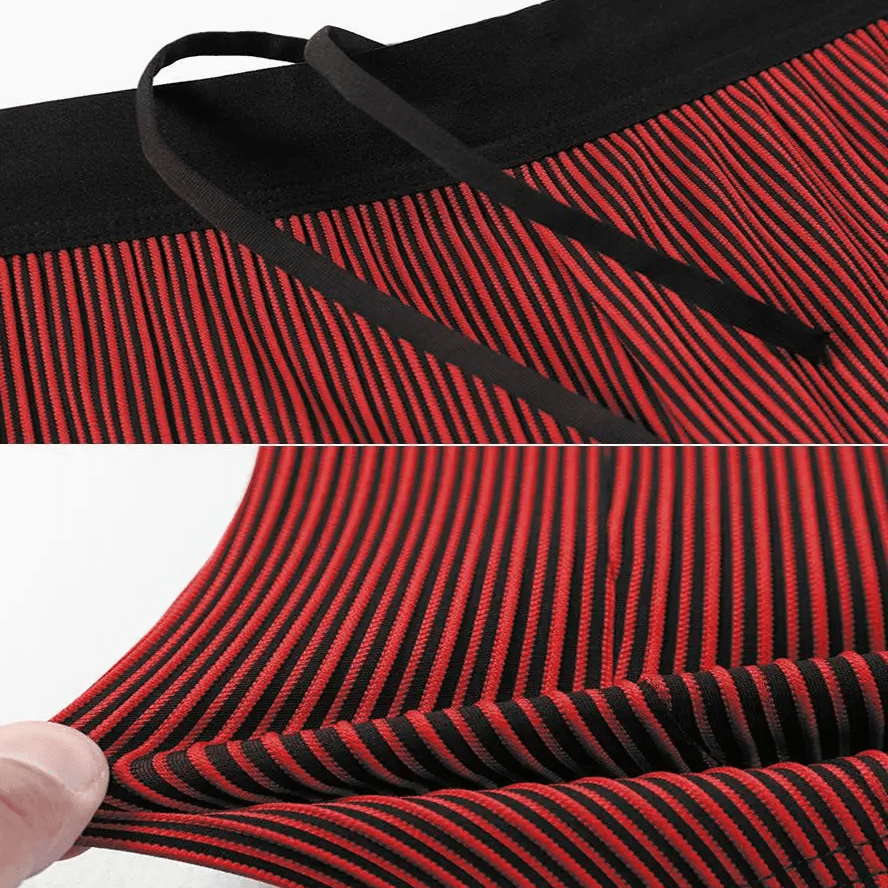 Close-up of red and black striped swim trunks with drawstring waistband and water-resistant fabric.