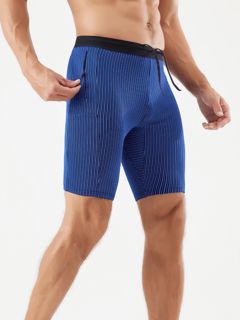 Men’s quick-dry striped swim trunks in vibrant blue with pocket, perfect for beach or pool. Stylish and water-resistant design with black waistband.