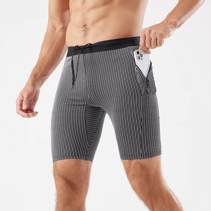 Men’s quick-dry striped swim trunks with phone pocket, showcasing water-resistant fabric and vibrant blue stripes.