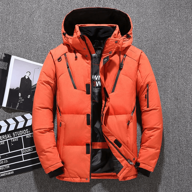Orange windproof hooded jacket for men, perfect for skiing and outdoor adventures. Features multiple pockets and durable zippers.