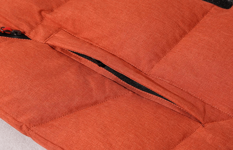 Close-up of orange windproof ski jacket with zipper detail from men's ski suit SF2045, showcasing durable polyester fabric.
