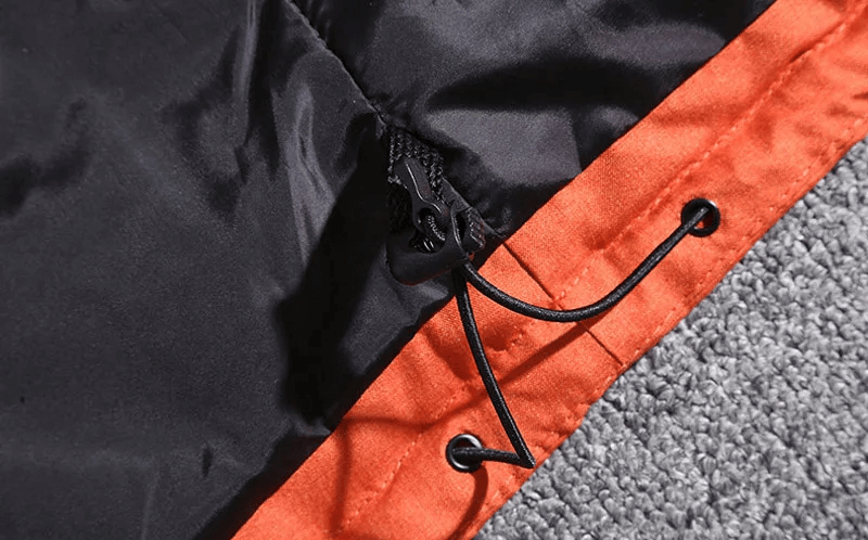 Close-up of the drawstring on the men's windproof ski suit jacket, featuring durable polyester material for winter sports.