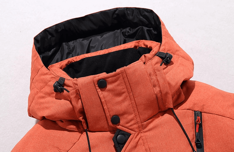 Men's windproof hooded ski jacket in orange, perfect for winter sports, offering warmth and style on the slopes with breathable material.