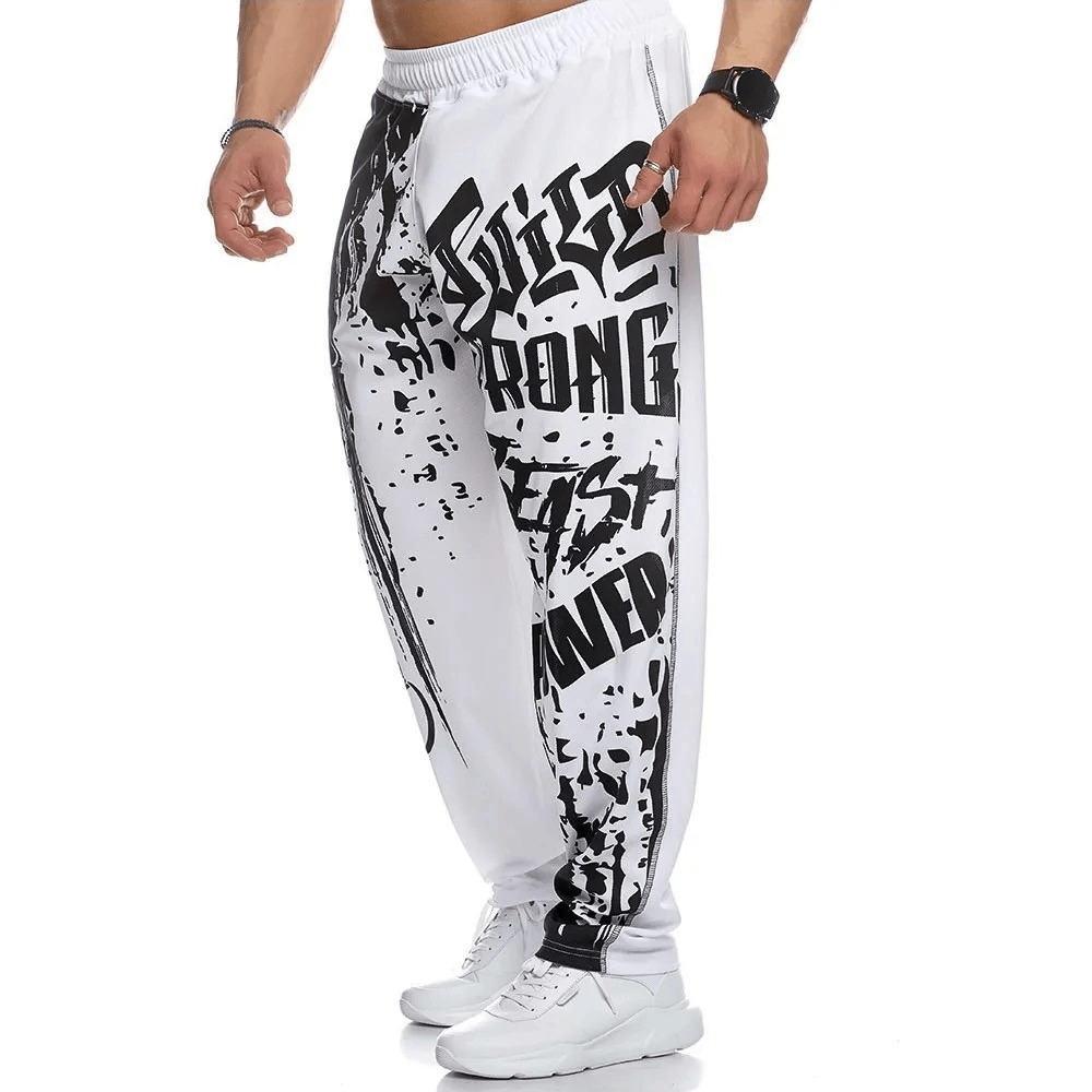 Men's athletic drip print sweatpants in white with striking graphics, featuring a snug fit and drawstring closure, perfect for gym workouts.