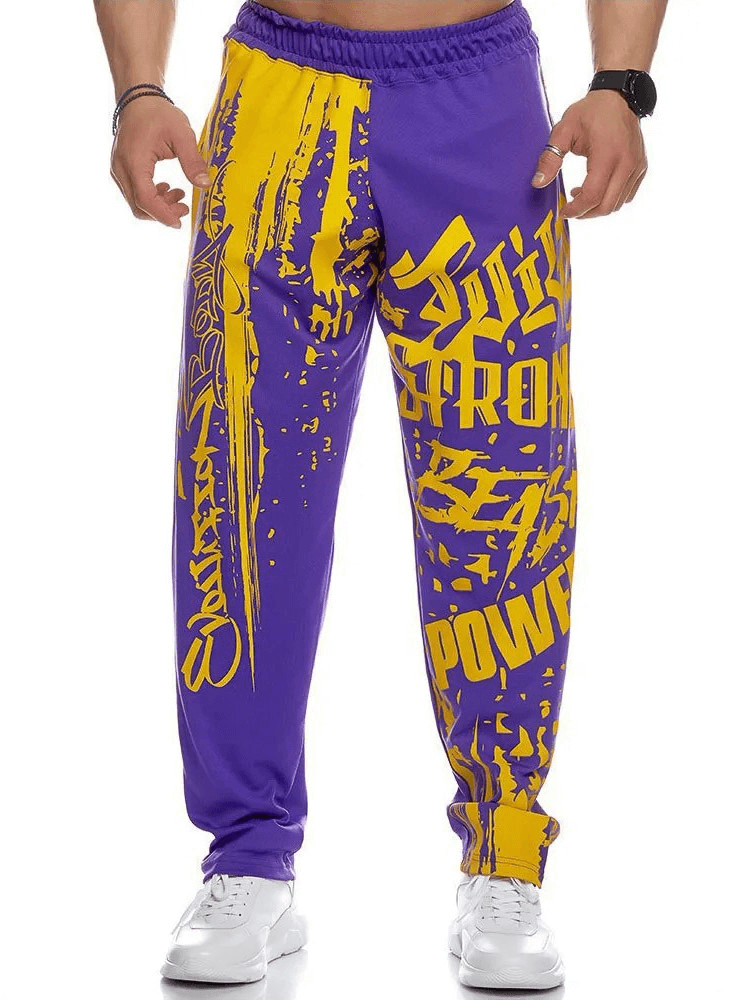 Men's Athletic Drip Print Sweatpants in purple and yellow, ideal for gym workouts and running with a fitted silhouette.